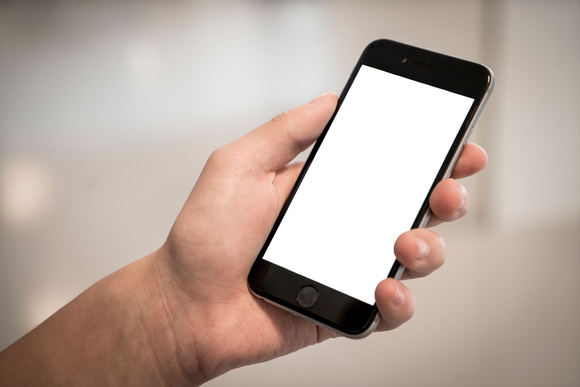 hands holding a smartphone showing a two factor authentication code on the screen